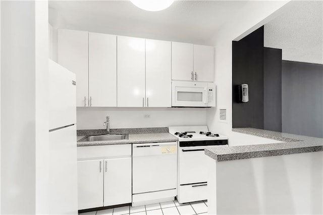 kitchen featuring white appliances, a sink, and white cabinets