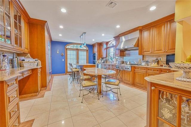1401 74th St, Brooklyn, NY 11228 - kitchen featuring wall chimney exhaust hood, decorative backsplash, recessed lighting, appliances with stainless steel finishes, and brown cabinetry