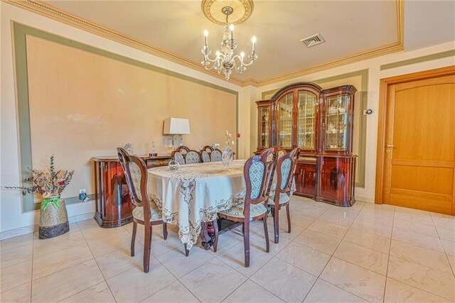 1401 74th St, Brooklyn, NY 11228 - dining area with a chandelier, ornamental molding, and light tile patterned floors