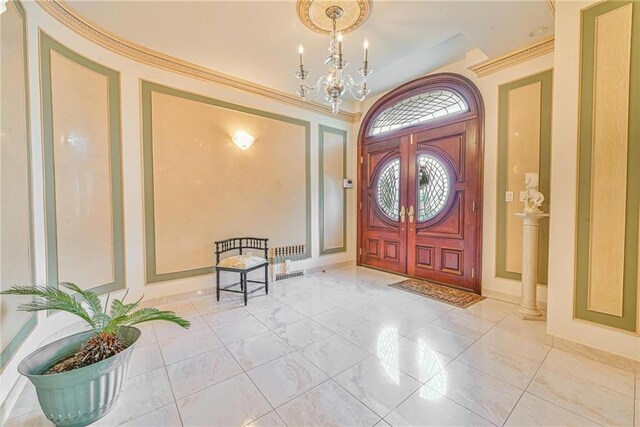 1401 74th St, Brooklyn, NY 11228 - foyer entrance with a chandelier, marble finish floors, and baseboards