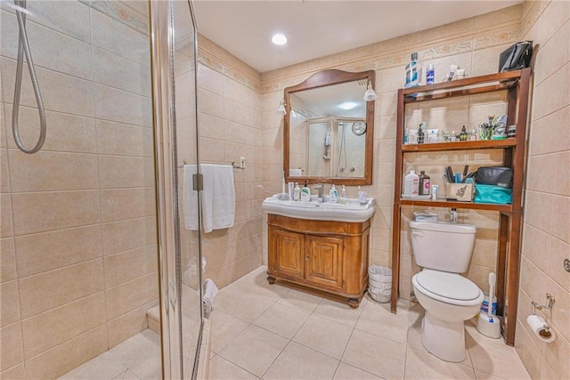 1401 74th St, Brooklyn, NY 11228 - bathroom with toilet, a stall shower, vanity, tile patterned flooring, and tile walls