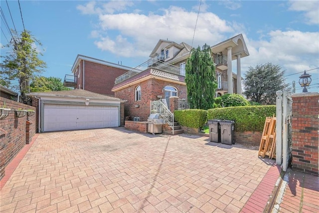 1401 74th St, Brooklyn, NY 11228 - view of front of home with a garage and brick siding