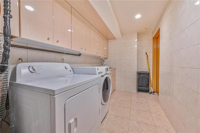 1401 74th St, Brooklyn, NY 11228 - laundry room with cabinet space, separate washer and dryer, tile walls, and light tile patterned floors