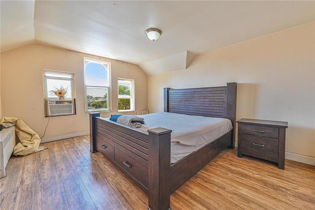 1401 74th St, Brooklyn, NY 11228 - bedroom featuring vaulted ceiling, light wood-style flooring, cooling unit, and baseboards