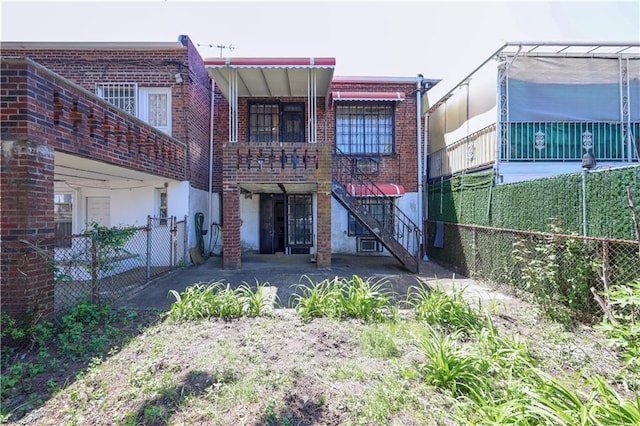 2327 E 16th St, Brooklyn, NY 11229 - rear view of house with brick siding and stairway