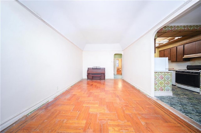 2327 E 16th St, Brooklyn, NY 11229 - unfurnished living room with arched walkways and baseboards