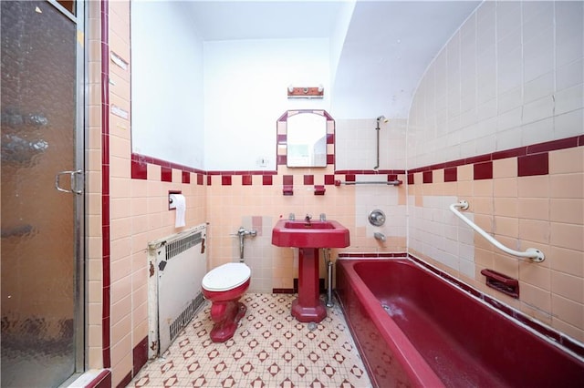 2327 E 16th St, Brooklyn, NY 11229 - full bath featuring radiator heating unit, tile walls, a bath, toilet, and a shower stall