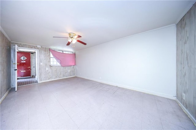 2327 E 16th St, Brooklyn, NY 11229 - empty room with a ceiling fan, baseboards, tile patterned floors, crown molding, and wood walls