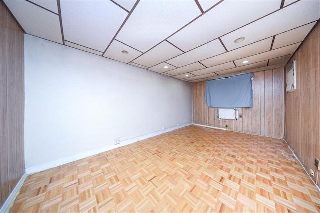 2327 E 16th St, Brooklyn, NY 11229 - unfurnished room with baseboards and wood walls