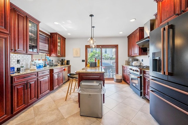 1440 81st St, Brooklyn, NY 11228 - kitchen with stainless steel appliances, reddish brown cabinets, tasteful backsplash, light stone counters, and recessed lighting