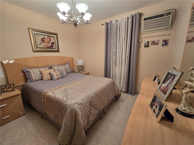 bedroom with a chandelier, light tile patterned floors, and a wall mounted air conditioner