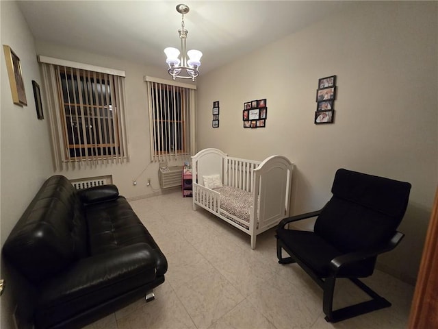 tiled bedroom featuring a chandelier and baseboards