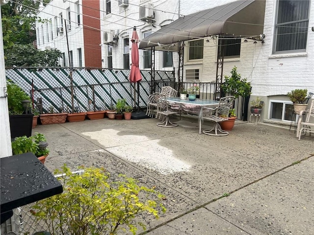 view of patio / terrace featuring fence