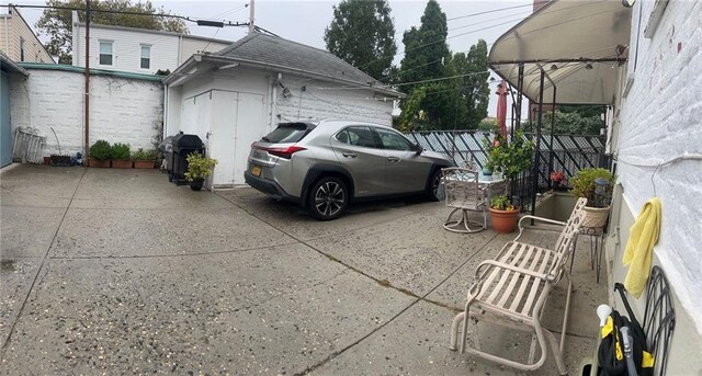 view of parking featuring fence
