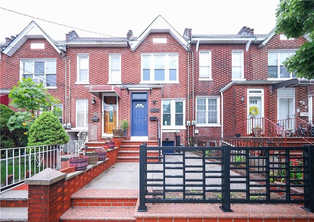 1238 77th St, Brooklyn, NY 11228 - view of property featuring a fenced front yard and brick siding