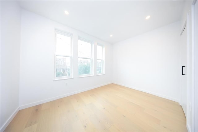 1238 77th St, Brooklyn, NY 11228 - empty room featuring light wood-type flooring and recessed lighting