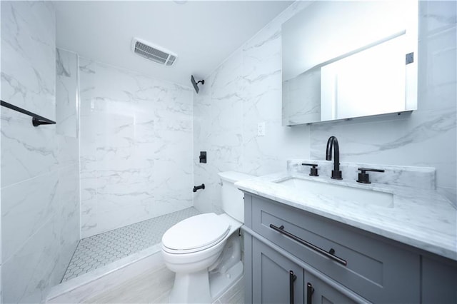 1238 77th St, Brooklyn, NY 11228 - bathroom featuring vanity, a marble finish shower, and tile walls