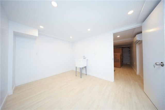 1238 77th St, Brooklyn, NY 11228 - empty room with recessed lighting, light wood-type flooring, and a wall mounted air conditioner
