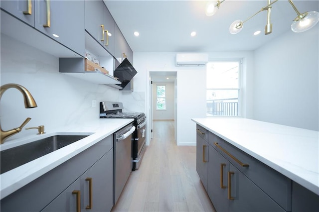 1238 77th St, Brooklyn, NY 11228 - kitchen featuring stainless steel appliances, a wall mounted air conditioner, light wood-style flooring, recessed lighting, and gray cabinets