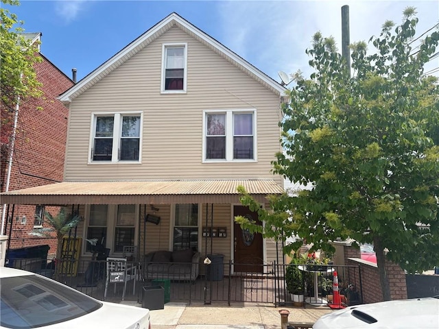 2349 W 12th St, Brooklyn, NY 11223 - view of front facade featuring a porch and outdoor lounge area