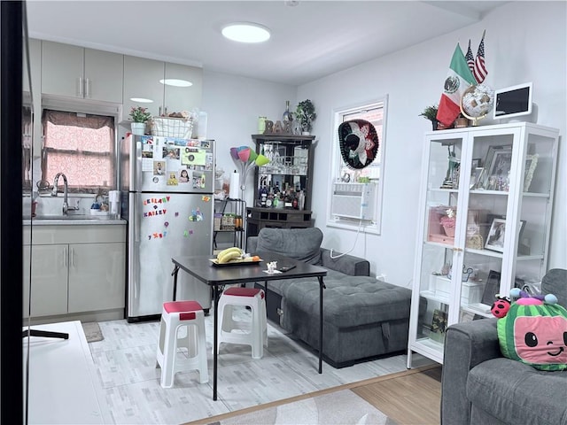 2349 W 12th St, Brooklyn, NY 11223 - kitchen featuring freestanding refrigerator, a sink, light wood-type flooring, and open floor plan