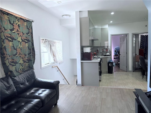 2349 W 12th St, Brooklyn, NY 11223 - living area featuring light wood finished floors and recessed lighting