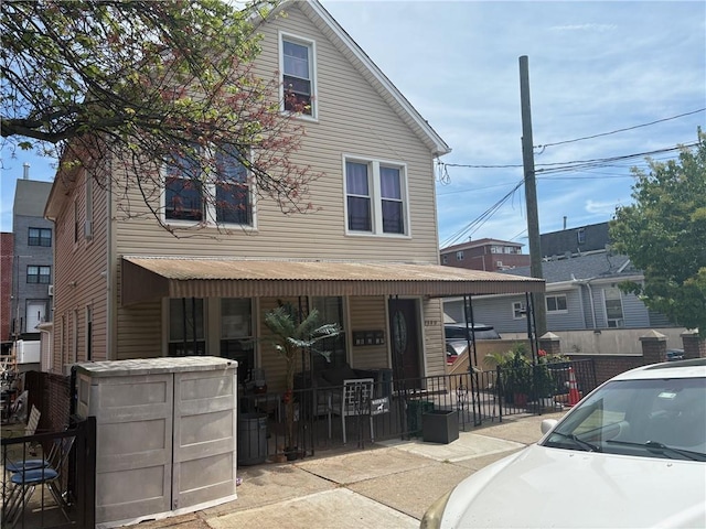 2349 W 12th St, Brooklyn, NY 11223 - view of front facade with covered porch and fence