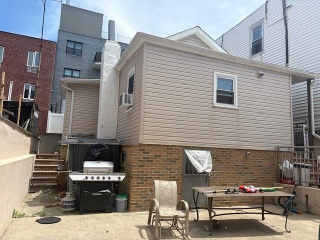 2349 W 12th St, Brooklyn, NY 11223 - rear view of property with a patio area and brick siding