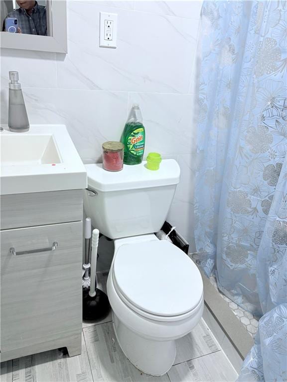 2349 W 12th St, Brooklyn, NY 11223 - bathroom with vanity, toilet, and a shower with shower curtain