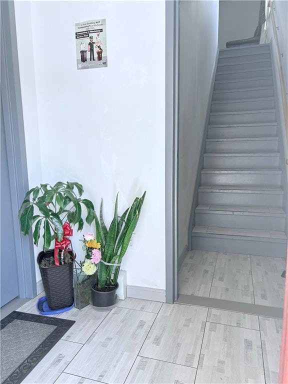 2349 W 12th St, Brooklyn, NY 11223 - staircase with wood finished floors and baseboards