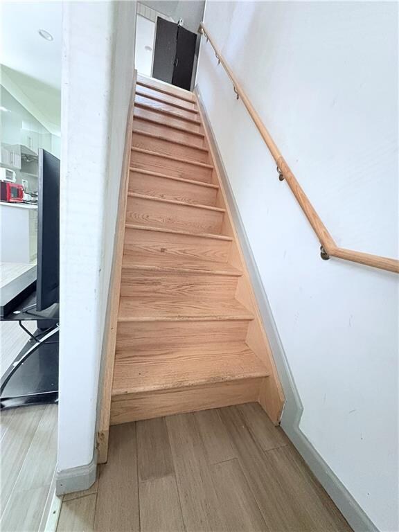2349 W 12th St, Brooklyn, NY 11223 - stairway featuring wood finished floors