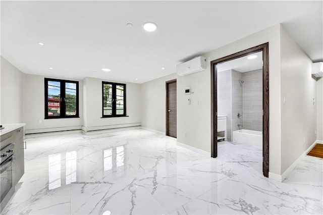 unfurnished living room with a wall mounted AC, light marble finish floors, recessed lighting, baseboards, and baseboard heating