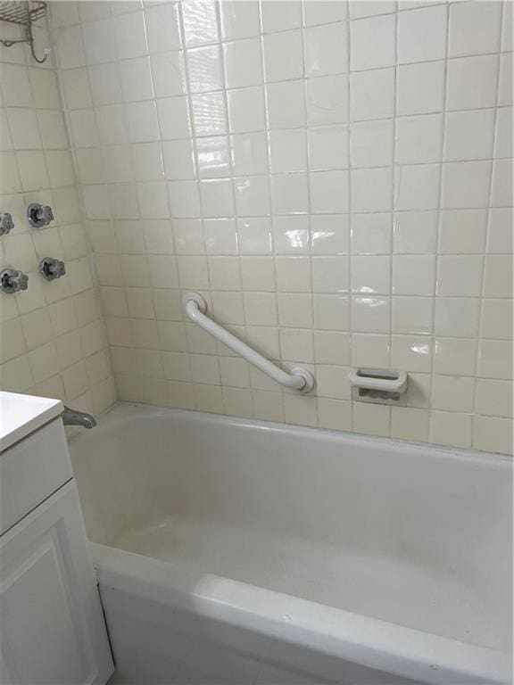 full bathroom with vanity and  shower combination