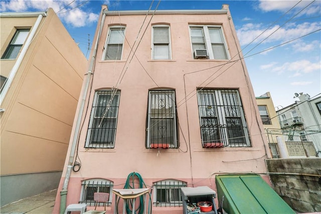 474 Senator St, Brooklyn, NY 11220 - view of home's exterior featuring stucco siding