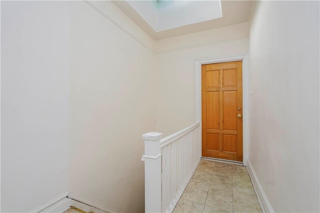 doorway featuring baseboards