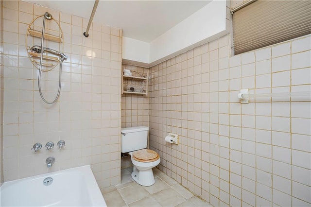 full bathroom with tile patterned floors, tile walls, toilet, and shower / tub combination