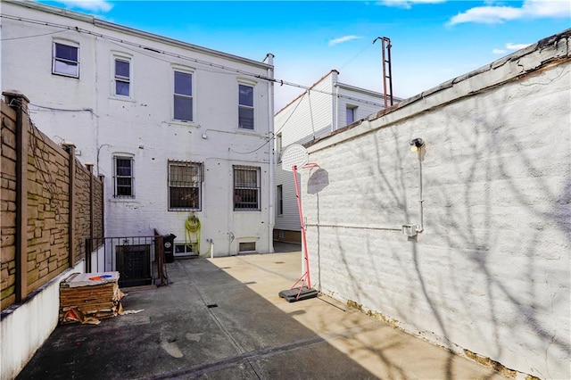 back of house with a patio area and fence