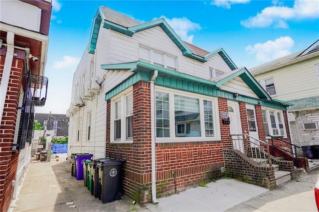 townhome / multi-family property with brick siding