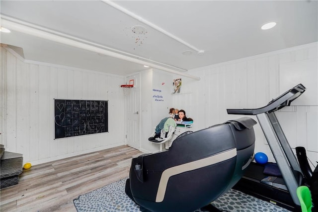 exercise room with wood finished floors