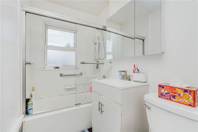 full bathroom featuring vanity, toilet, and washtub / shower combination