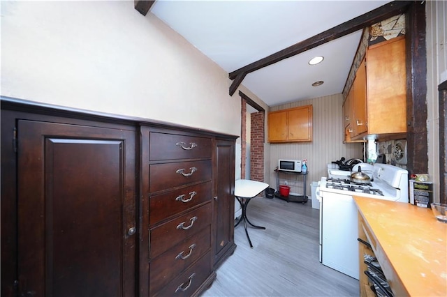 kitchen featuring white appliances, light countertops, light wood-type flooring, beam ceiling, and recessed lighting