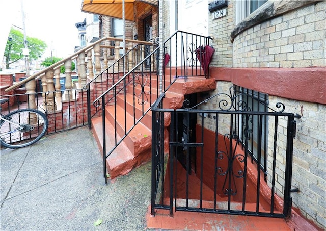 gate featuring stairway and fence