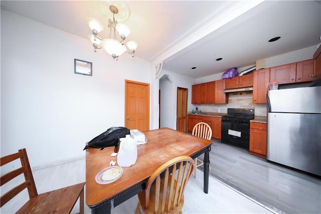 1214 74th St, Brooklyn, NY 11228 - dining space with a chandelier and light wood-type flooring
