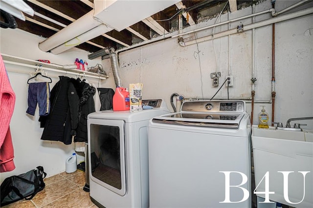 2538 Mill Ave, Brooklyn, NY 11234 - washroom with washing machine and clothes dryer and light tile patterned floors