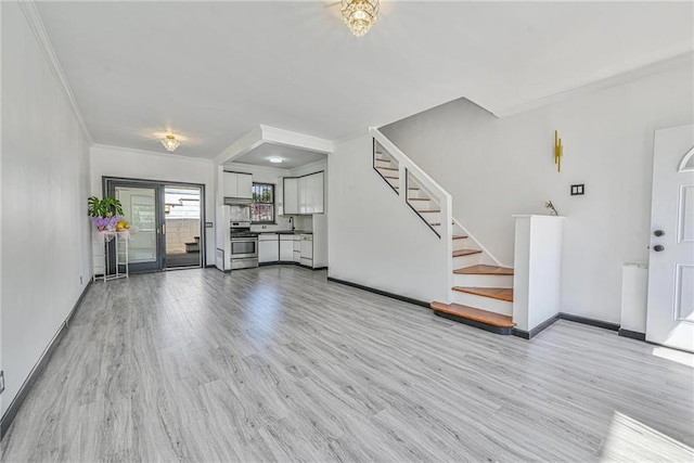 1155 Shore Pkwy, Brooklyn, NY 11214 - unfurnished living room featuring ornamental molding, stairway, and wood finished floors