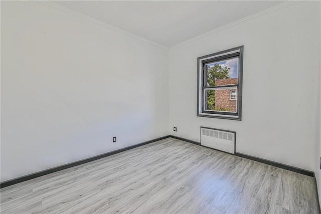 1155 Shore Pkwy, Brooklyn, NY 11214 - spare room with radiator, wood finished floors, and ornamental molding