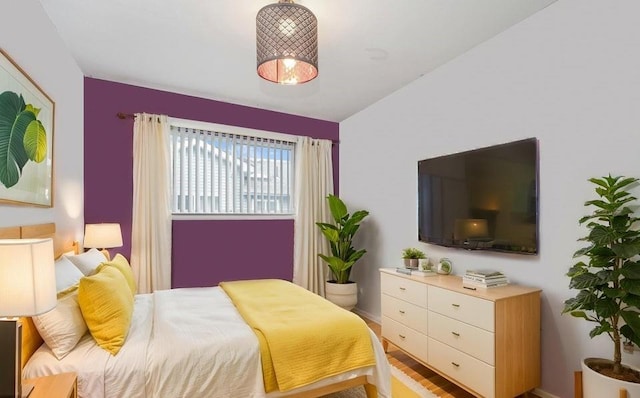 bedroom featuring wood finished floors