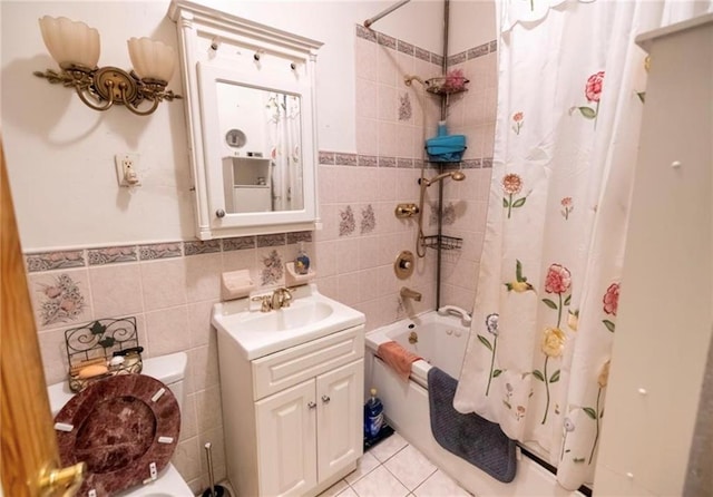 1777 Union St, Brooklyn, NY 11213 - full bathroom featuring tile walls, shower / bath combination with curtain, toilet, vanity, and tile patterned floors