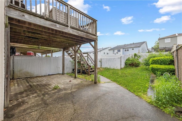 view of patio / terrace with stairs, fence, and a wooden deck