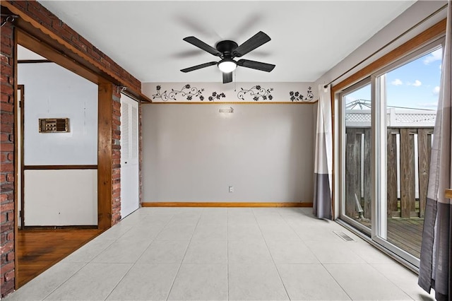 unfurnished room with a ceiling fan